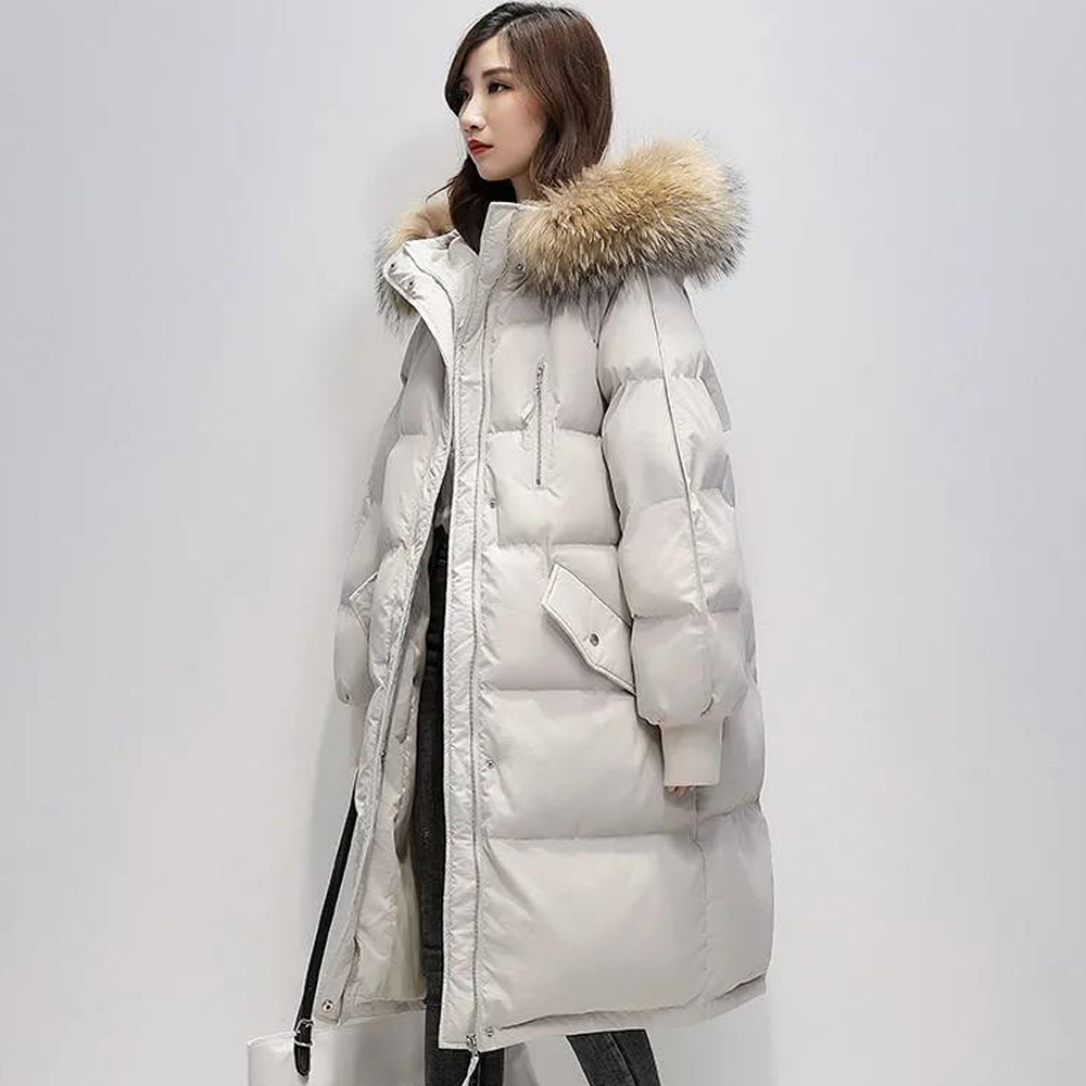 Parka longue matelassée Judith avec capuche en fausse fourrure pour femme.