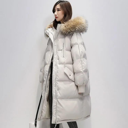 Parka longue matelassée Judith avec capuche en fausse fourrure pour femme.