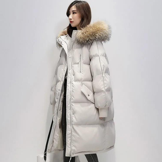 Parka longue matelassée Judith avec capuche en fausse fourrure pour femme.