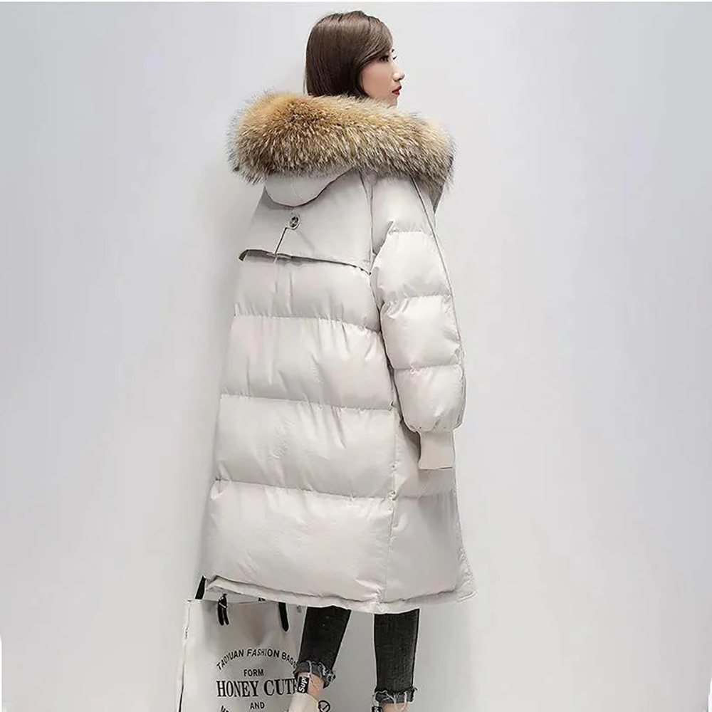 Parka longue matelassée Judith avec capuche en fausse fourrure pour femme.